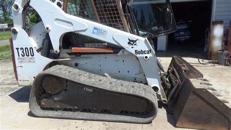 Skid steer / Skid loader track adjust, grease, and routine